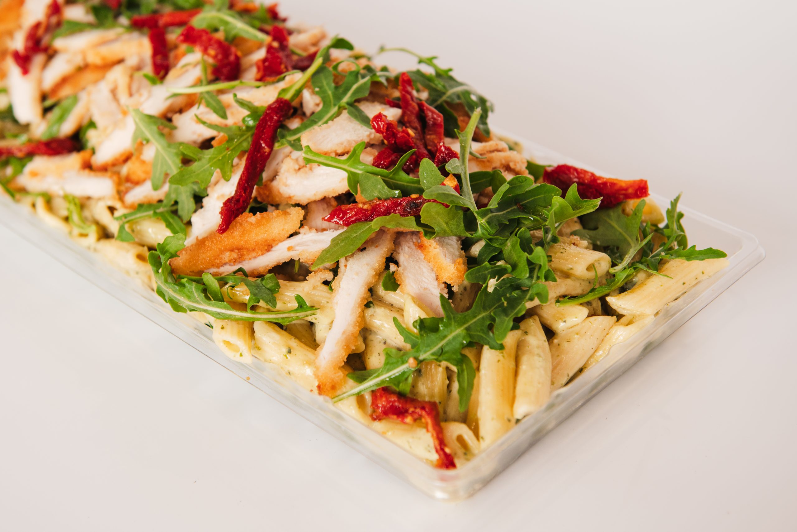 Fresh pesto pasta tray from Top Fruit Market Greenacre Sydney, available in small, large, and catering sizes.