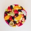 Fresh fruit salad tub from Top Fruit Market Greenacre Sydney with seasonal fruit including melon, pineapple, grapes, berries, and mango.